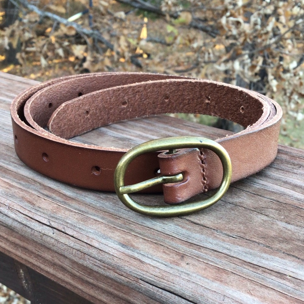 A set of two belts, one black floral belt & one a golden brown belt - Picture 2 of 5